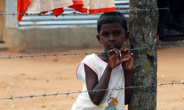 http://tamizhanban.files.wordpress.com/2009/08/tamil-boy-inside-a-tamil-refugee-camp.jpg